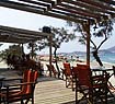 Having a coffee at the beach of Agios Georgios (Saint George)
